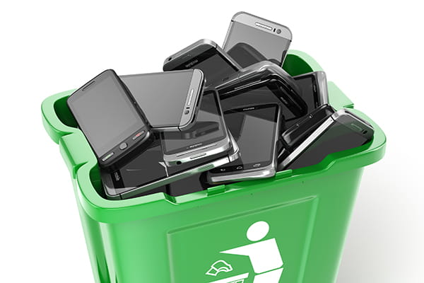 612dc71b0e28fa67eac973ee_recycling-bin-filled-with-old-mobile-phones_main